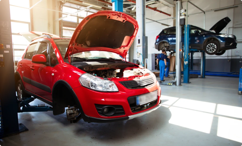 Professional man working on car full shot